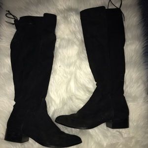 Tall black knee high boots